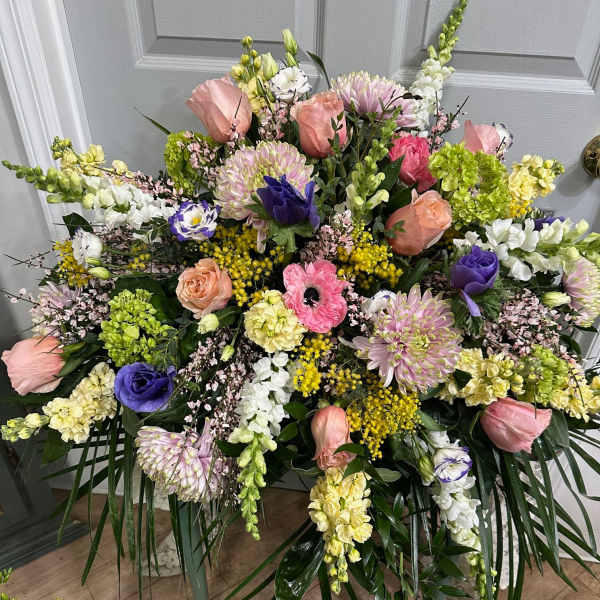 Large mixed floral spray with pink, purple, white, and yellow blooms