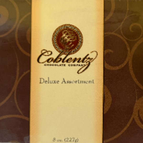 Box of assorted chocolates with a gold label