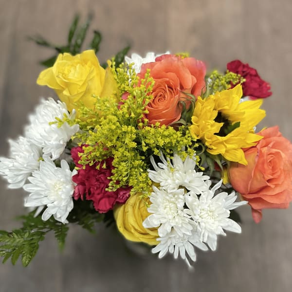 Mixed bouquet of roses, chrysanthemums, and carnations in bright colors