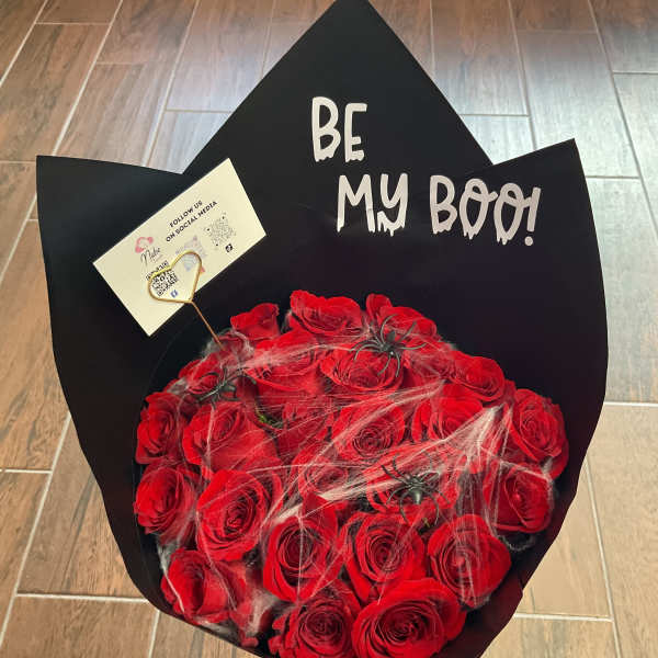 Red rose bouquet with black wrap and "Be My Boo!" sign