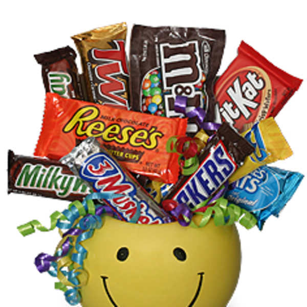 Smiley-face container filled with assorted candy bars and curled ribbons