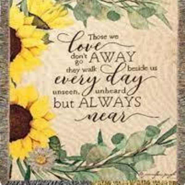 Sunflower-themed decorative blanket with a quote in the center