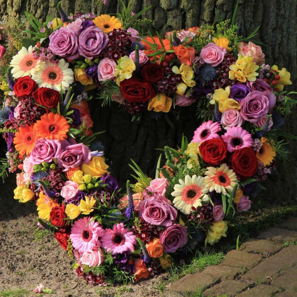 Heart-shaped floral wreath with roses and gerbera daisies