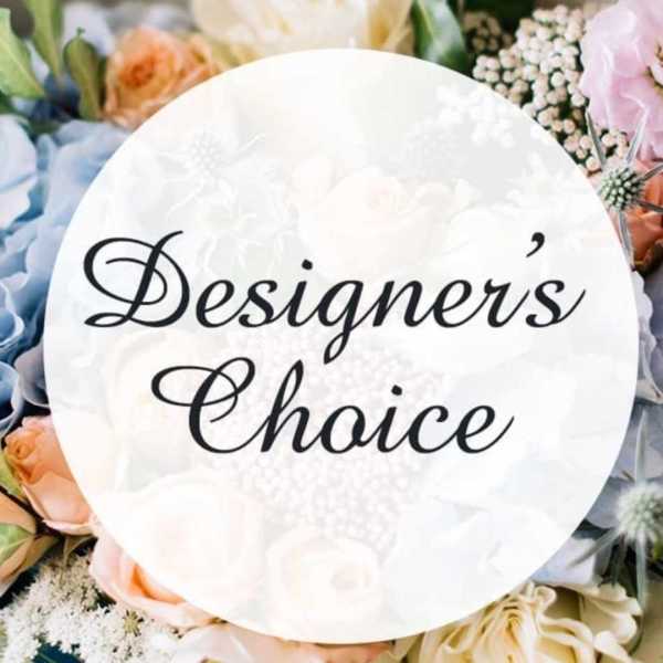 Round sign reading "Designer's Choice" surrounded by pastel flowers