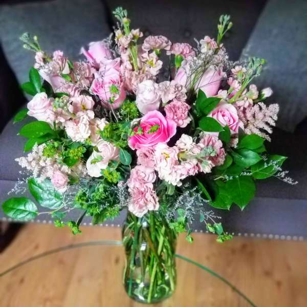 Pink mixed bouquet in a clear glass vase