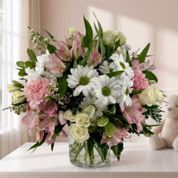 Pink and white mixed bouquet in a clear glass vase
