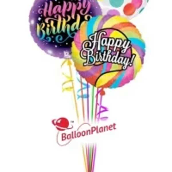 Cluster of colorful birthday balloons with printed messages.