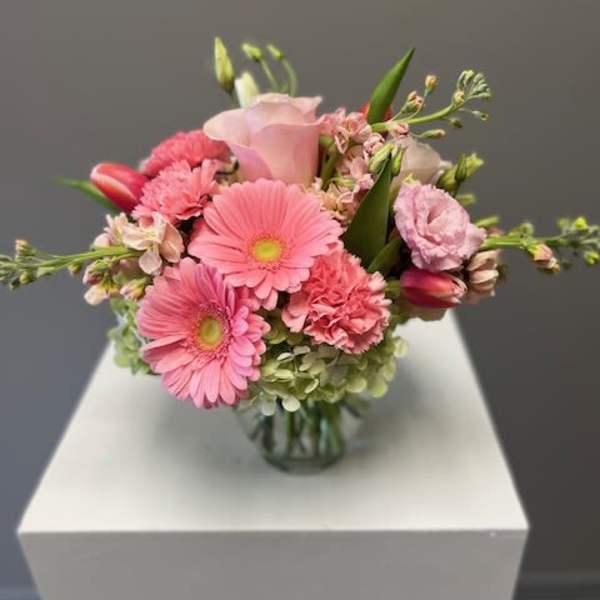 Pink mixed bouquet in a clear glass vase