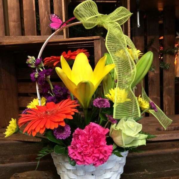 Colorful flower basket with lilies, gerbera daisies, carnations, and roses