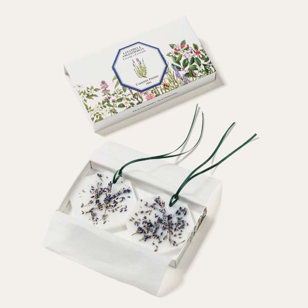 Two floral wax sachets in a gift box with lavender sprigs