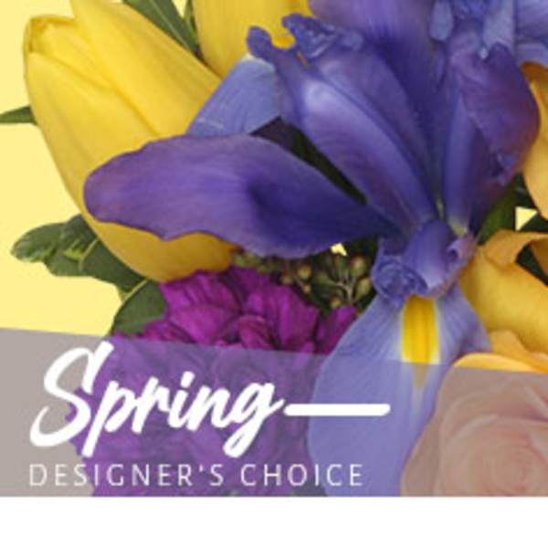Bouquet of yellow and purple tulips with a spring designer's choice label