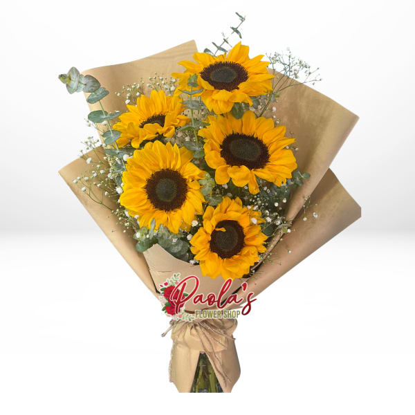 Bouquet of sunflowers wrapped in brown paper with a ribbon