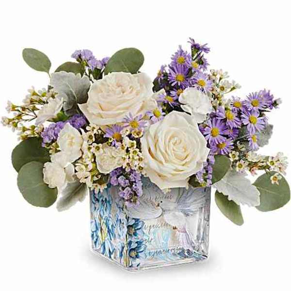 White roses and purple daisies in a square glass vase