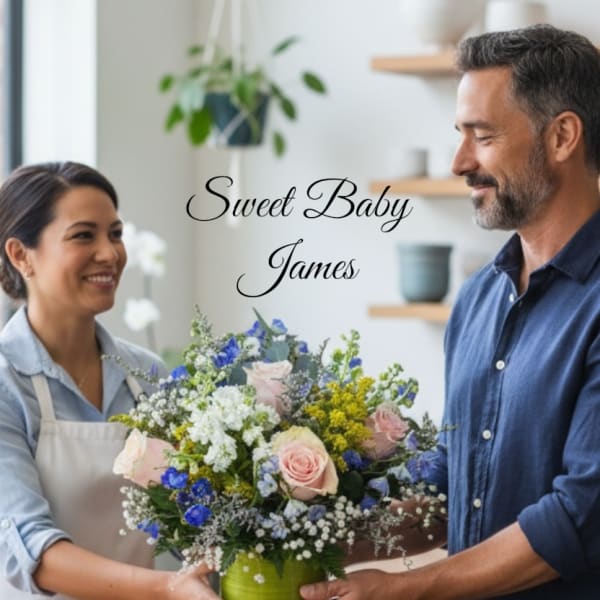 Mixed bouquet in a green vase with pink and blue flowers