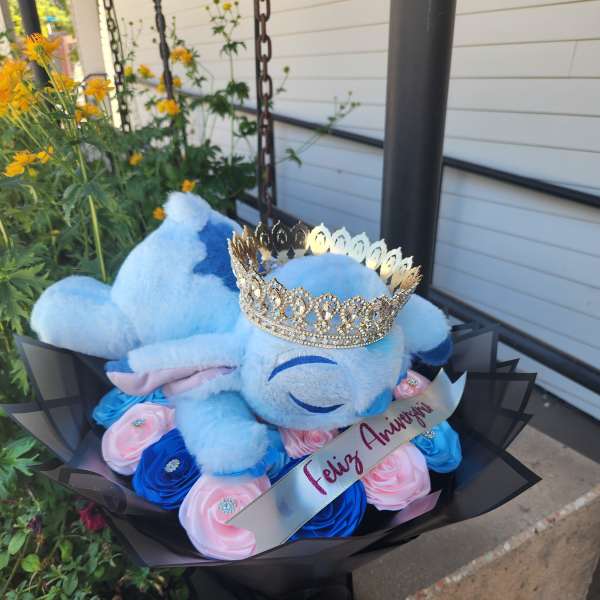 Blue teddy bear bouquet with pink and blue roses and a jeweled crown