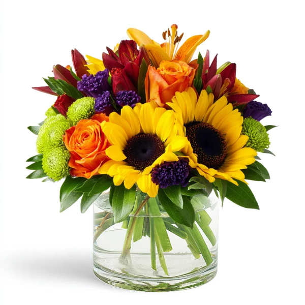 Bouquet of sunflowers, orange roses, and purple flowers in a glass vase