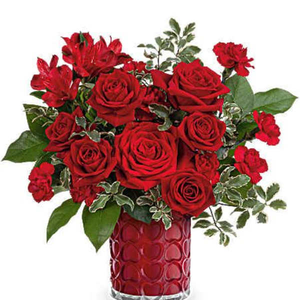 Red roses and carnations in a red textured vase