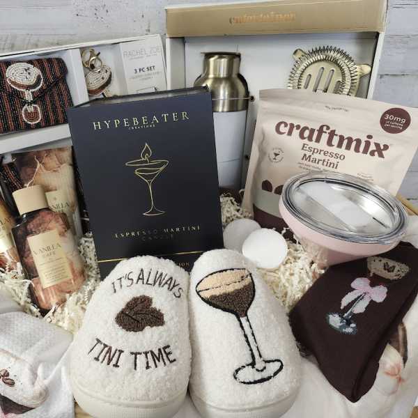 Gift basket with cocktail mix, tumblers, socks, and accessories