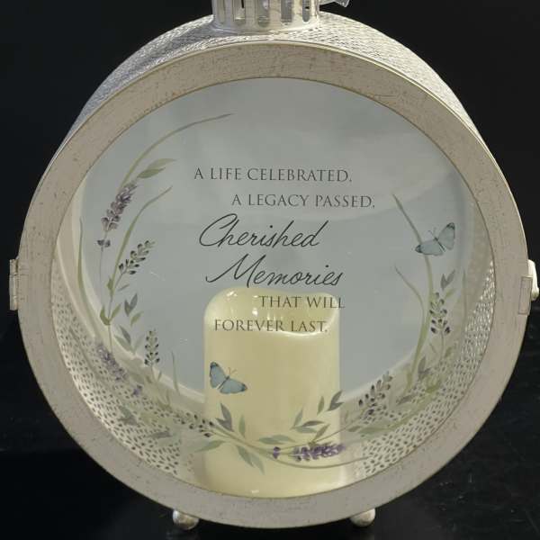 Decorative memorial lantern with a candle and butterfly design