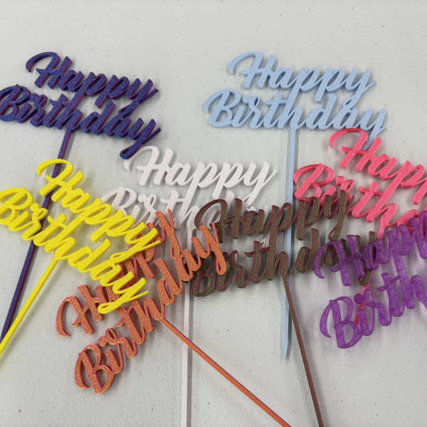 Colorful glitter birthday cake toppers with script text on sticks