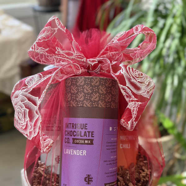 Gift basket with cocoa mix and a pink ribbon bow