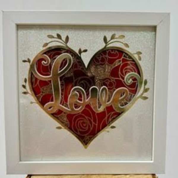 Framed heart artwork with the word Love in the center