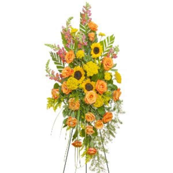 Tall floral standing spray with orange roses and yellow sunflowers