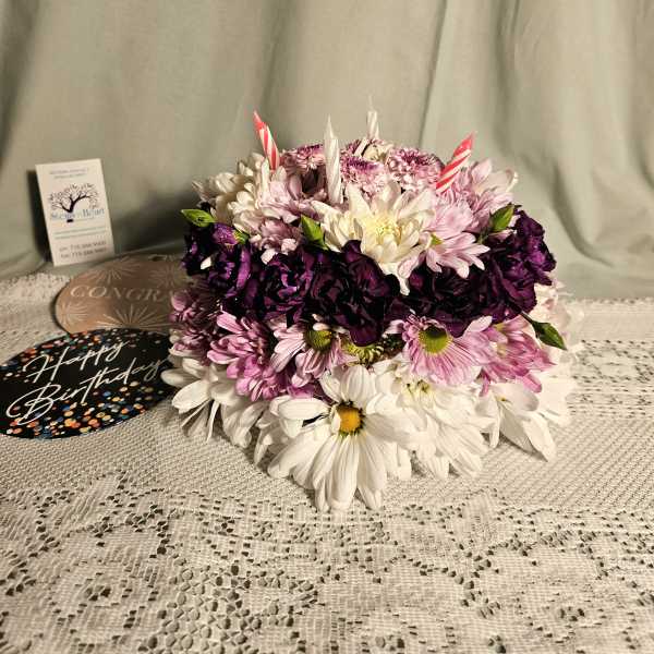 Round bouquet of pink, white, and purple daisies with birthday picks