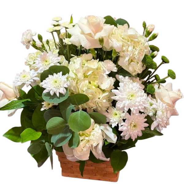 White and pale pink flowers arranged in a woven basket