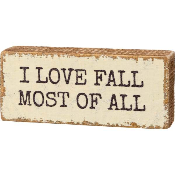 Wooden block sign with the words I LOVE FALL MOST OF ALL