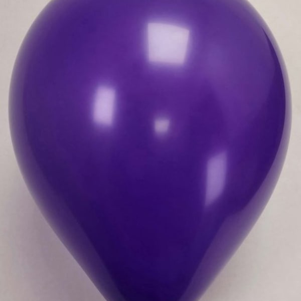 Single purple balloon on a plain background