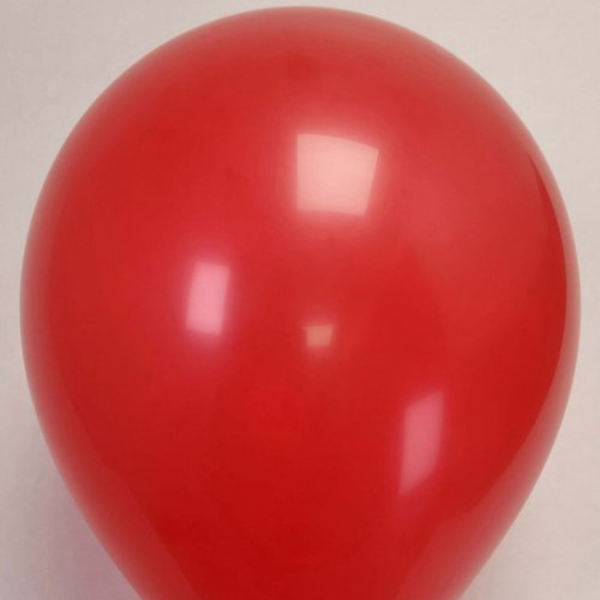 Red helium balloon on a plain background