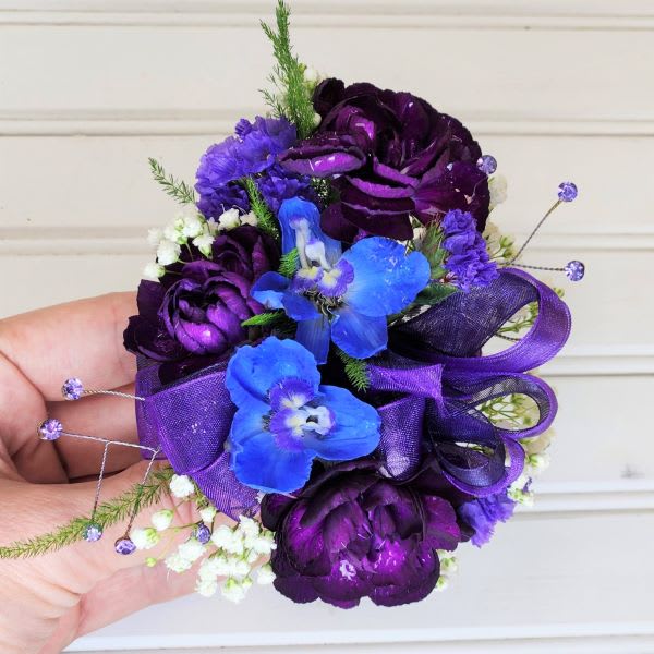 Purple and blue floral wrist corsage with ribbon