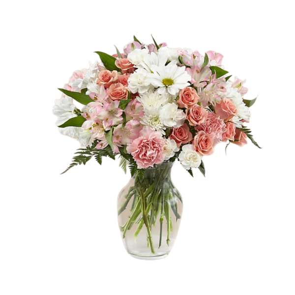 Pink and white mixed bouquet in a clear glass vase