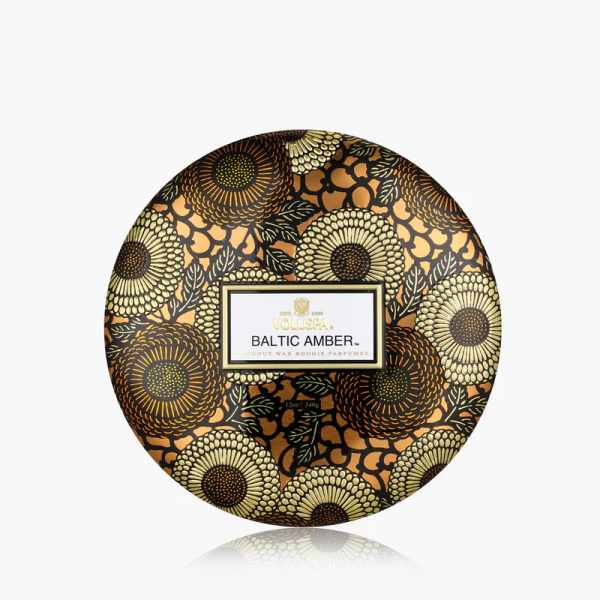 Round floral-patterned candle tin labeled Baltic Amber