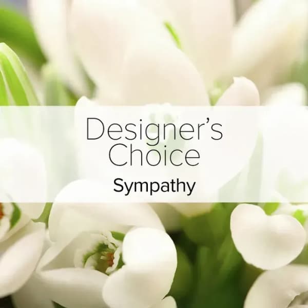 White flowers with a "Designer’s Choice Sympathy" label