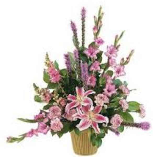 Pink lilies and mixed pink flowers in a gold vase