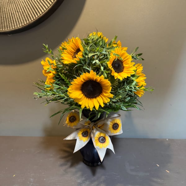 Sunflower arrangement in a black vase with a sunflower ribbon bow