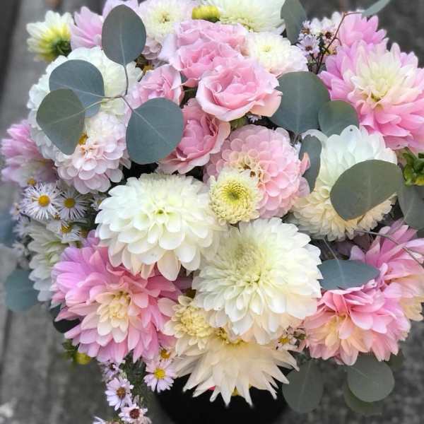 Bouquet of pink and white dahlias with eucalyptus