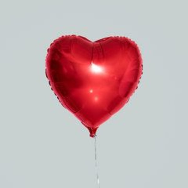 Red heart-shaped balloon with a thin string