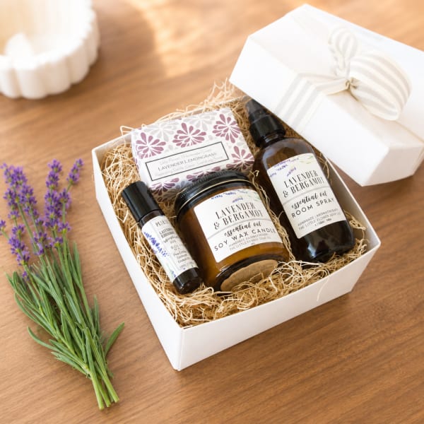Lavender gift box with candles, room spray, soap, and dried lavender sprigs