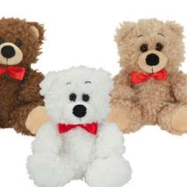 Three teddy bears with red bows on a white background