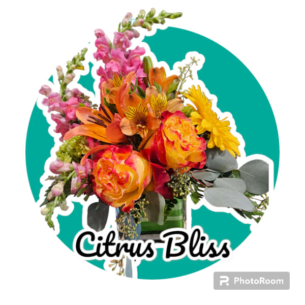 Bouquet of orange, pink, and yellow flowers with eucalyptus