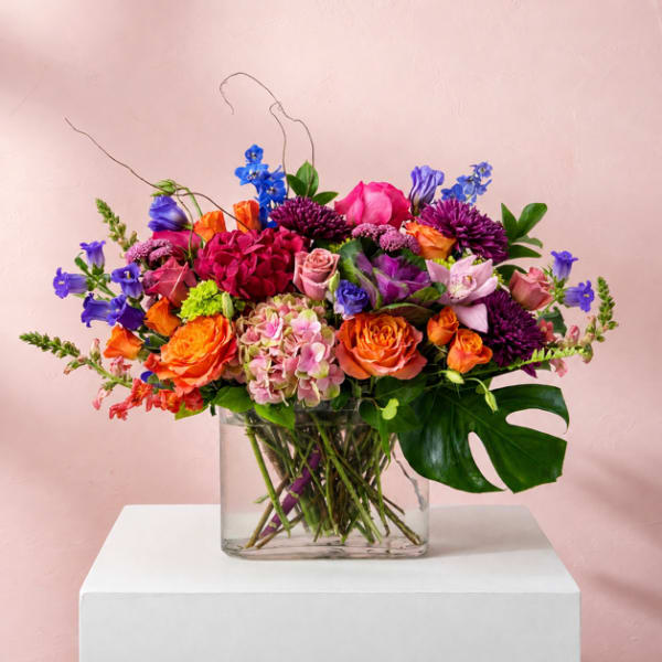 Colorful mixed bouquet in a clear glass vase