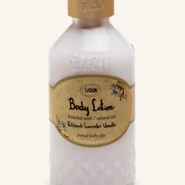 Bottle of Sabon body lotion with a gold pump dispenser