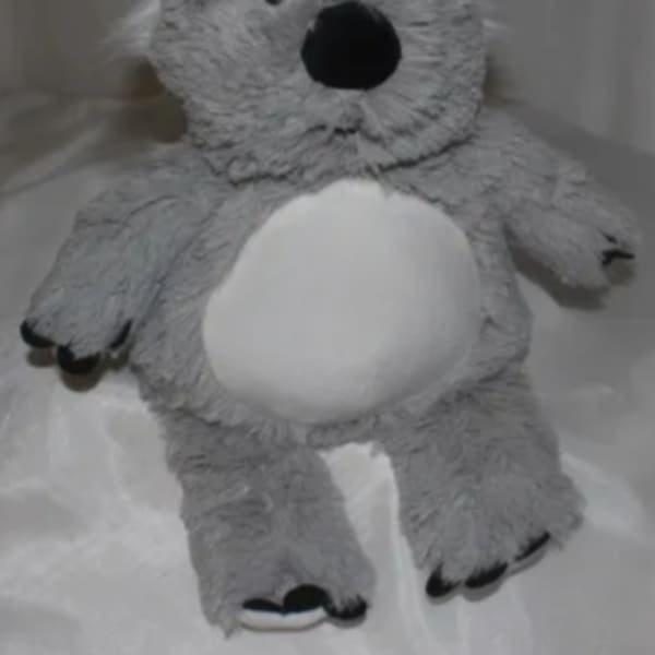 Gray plush teddy bear with a white belly and black nose