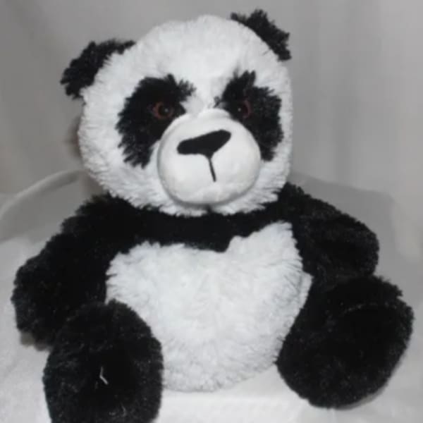 Black-and-white plush panda bear sitting upright