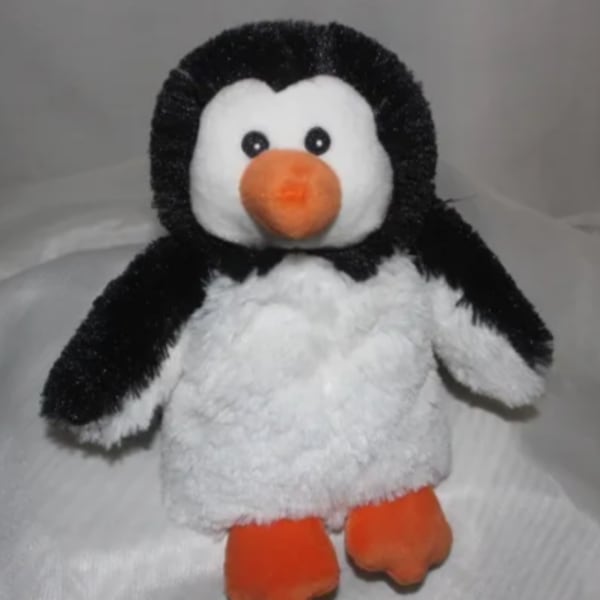 Plush penguin toy with black, white, and orange coloring