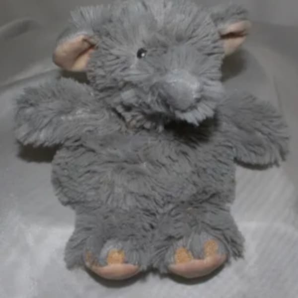 Gray plush teddy bear with beige paws and ears