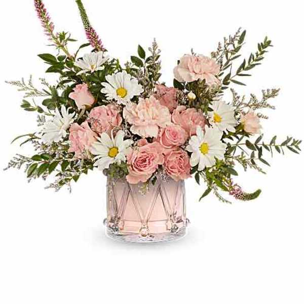 Pink roses and white daisies in a clear glass vase